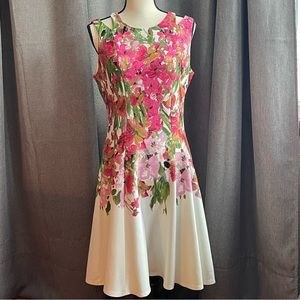Sleeveless floral party dress. Fitted at waist and a Size 10